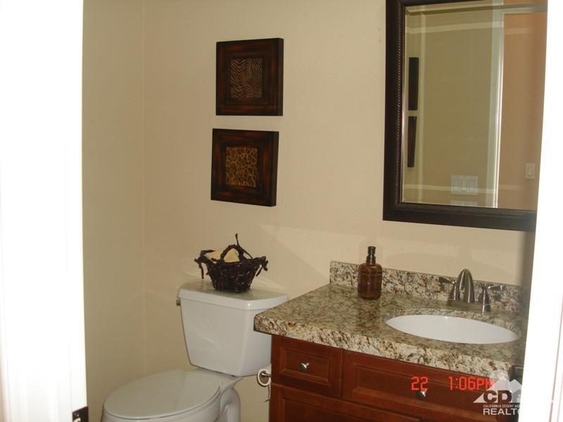 83436 Lightning Road Indio, CA 92203 - Photo 17 of 23 a bathroom with a granite countertop sink and a mirror