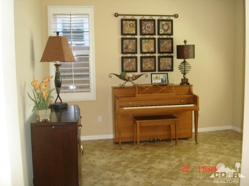 83436 Lightning Road Indio, CA 92203 - Photo 7 of 23 a living room with a table and a flat screen tv