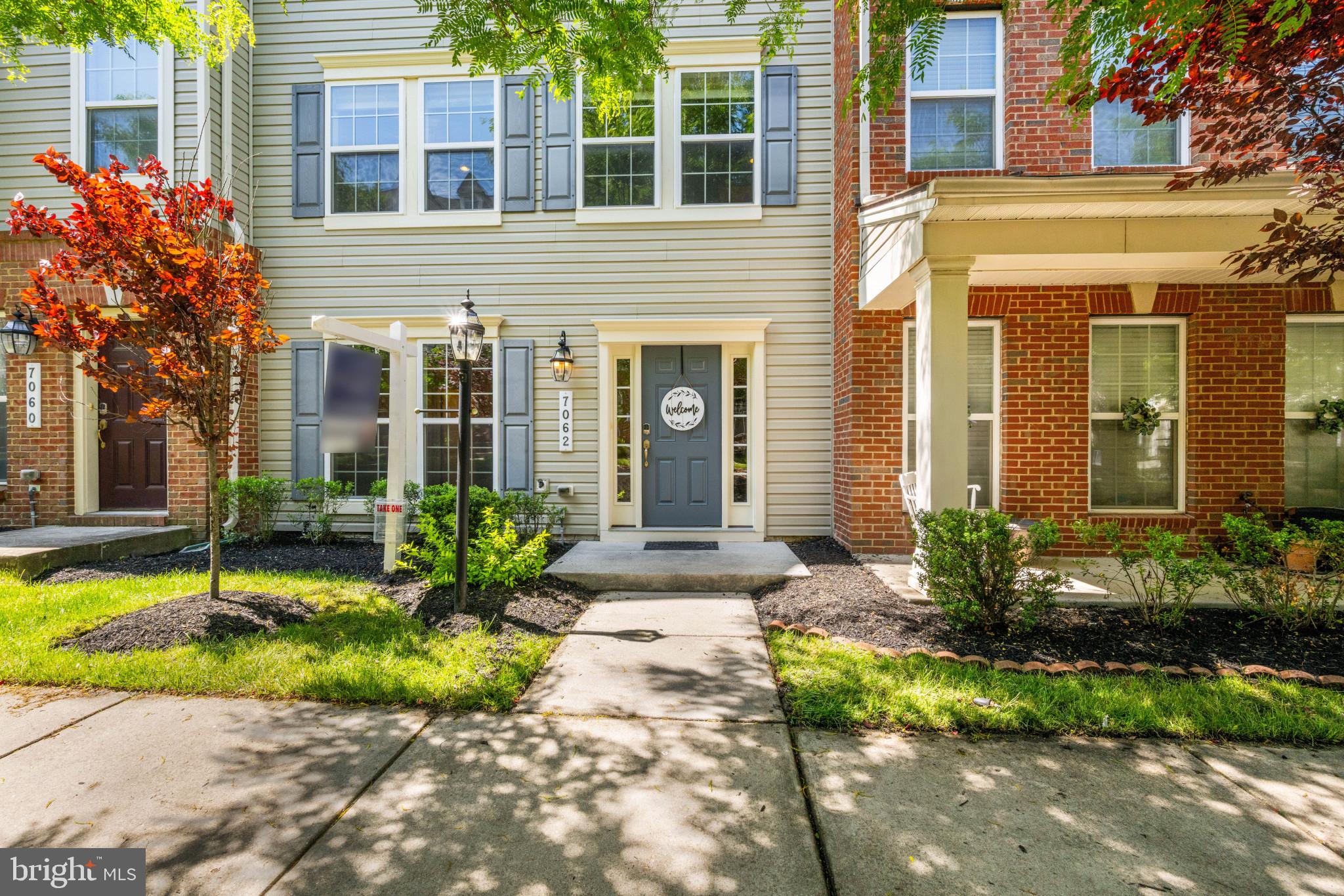 7062 Foxton Way Hanover, MD 21076 - Photo 4 of 41 a front view of a house having yard