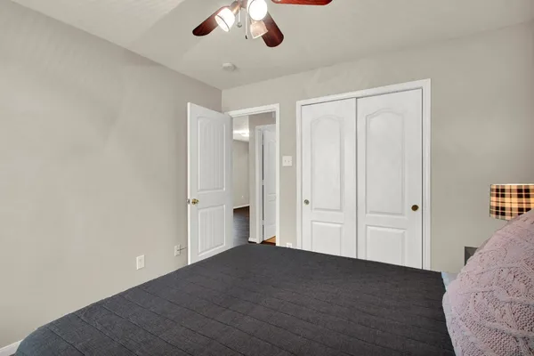 a view of livingroom with hardwood floor and ceiling fan