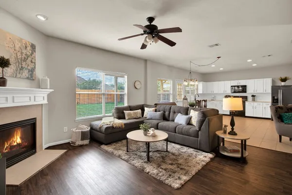 a living room with furniture and a fireplace