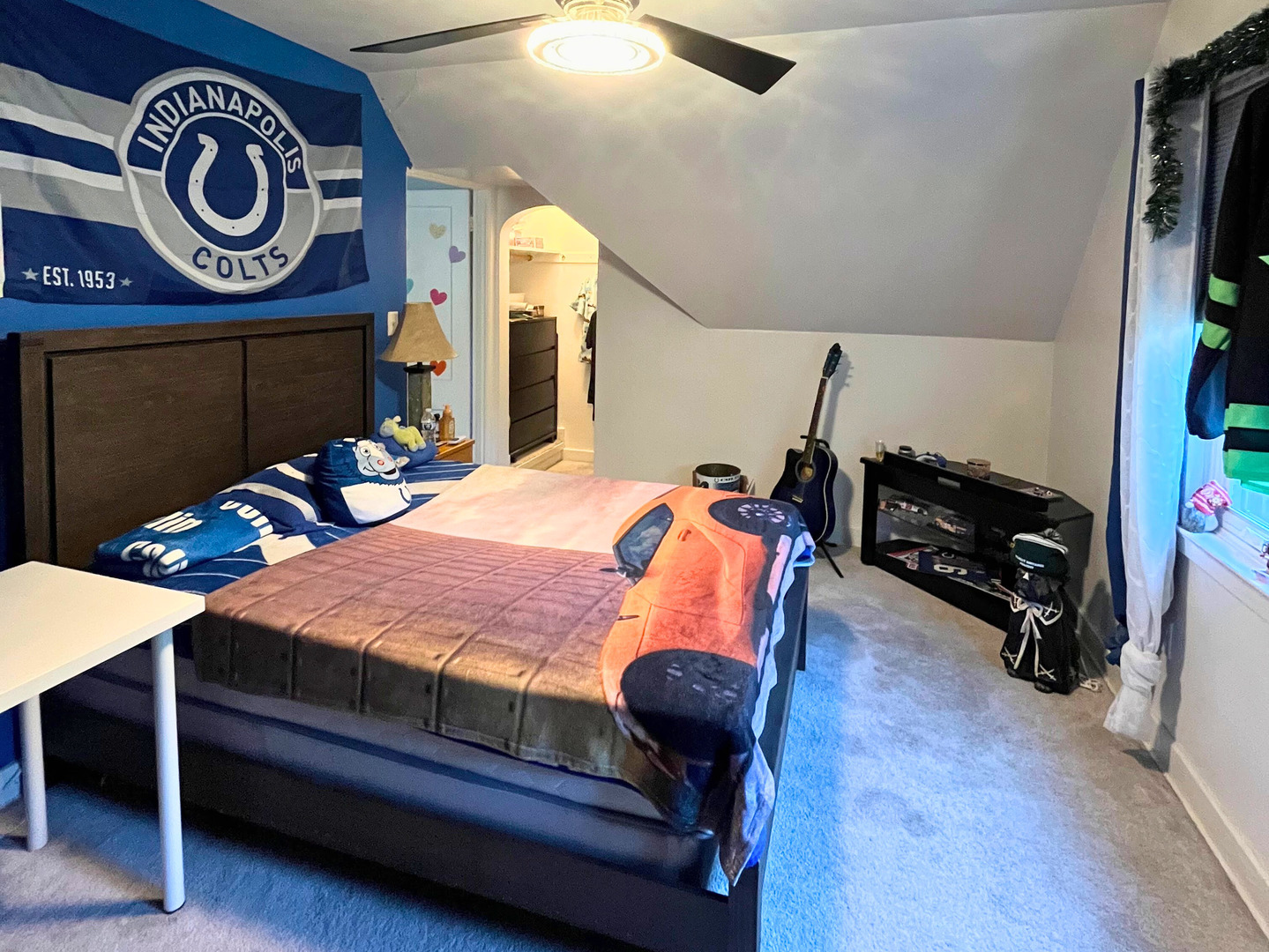 1010 Black Road Joliet, IL 60435 - Photo 11 of 17 a bedroom with a bed and a chandelier