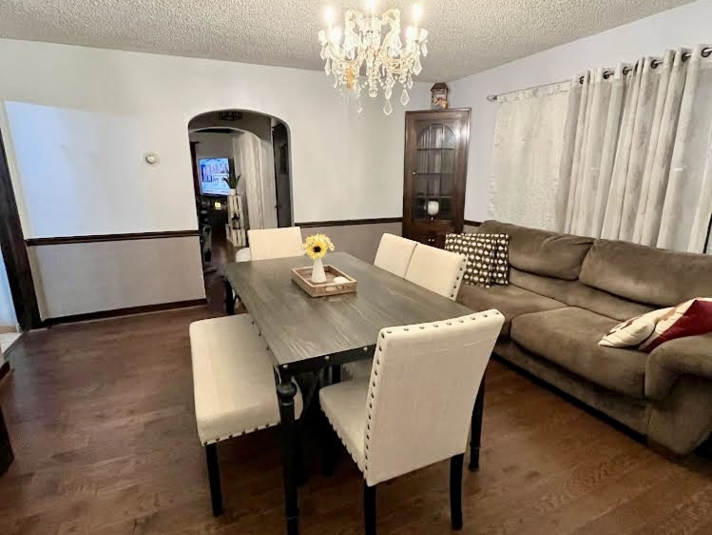 1010 Black Road Joliet, IL 60435 - Photo 6 of 17 a living room with furniture and a chandelier