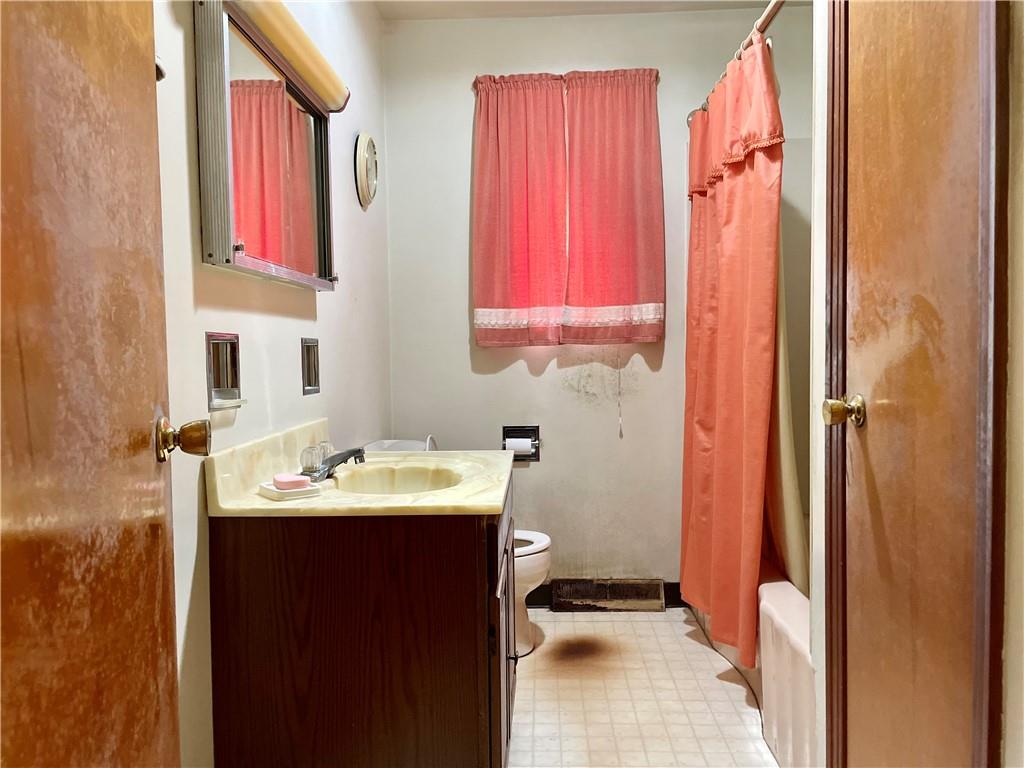 156 County Line Road Acme, PA 15610 - Photo 12 of 19 a bathroom with a sink vanity and a mirror