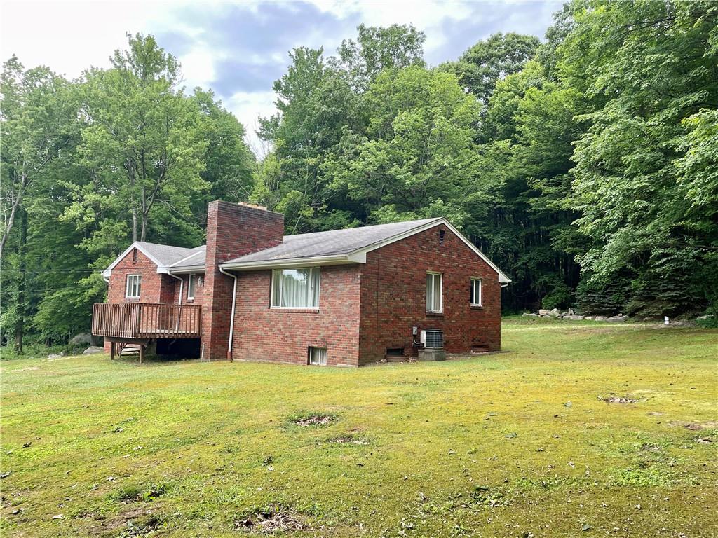156 County Line Road Acme, PA 15610 - Photo 15 of 19 a house view with a garden space