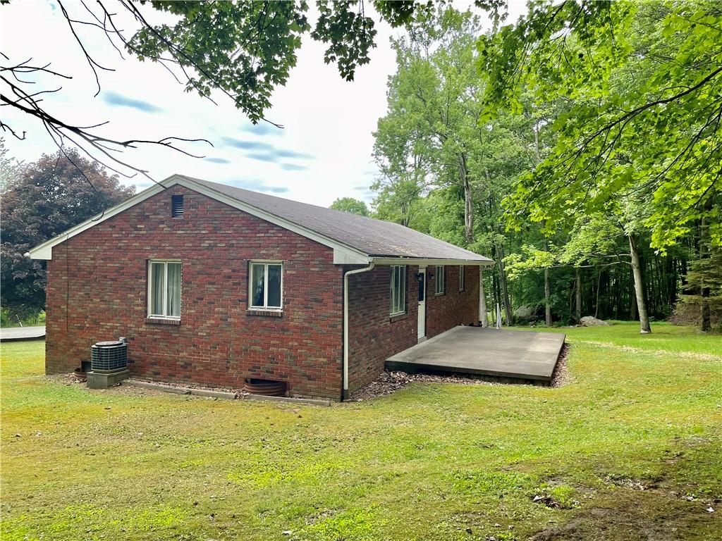 156 County Line Road Acme, PA 15610 - Photo 16 of 19 a backyard of a house with table and sofas