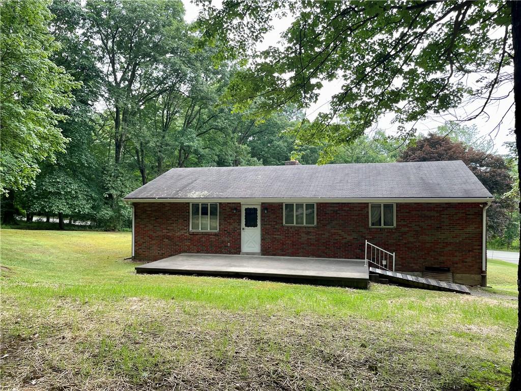 156 County Line Road Acme, PA 15610 - Photo 17 of 19 a front view of a house with a garden