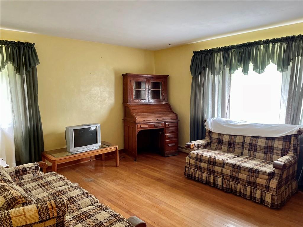 156 County Line Road Acme, PA 15610 - Photo 2 of 19 a bedroom with a bed and a fireplace