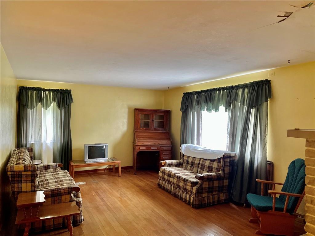 156 County Line Road Acme, PA 15610 - Photo 3 of 19 a living room with furniture and a fireplace