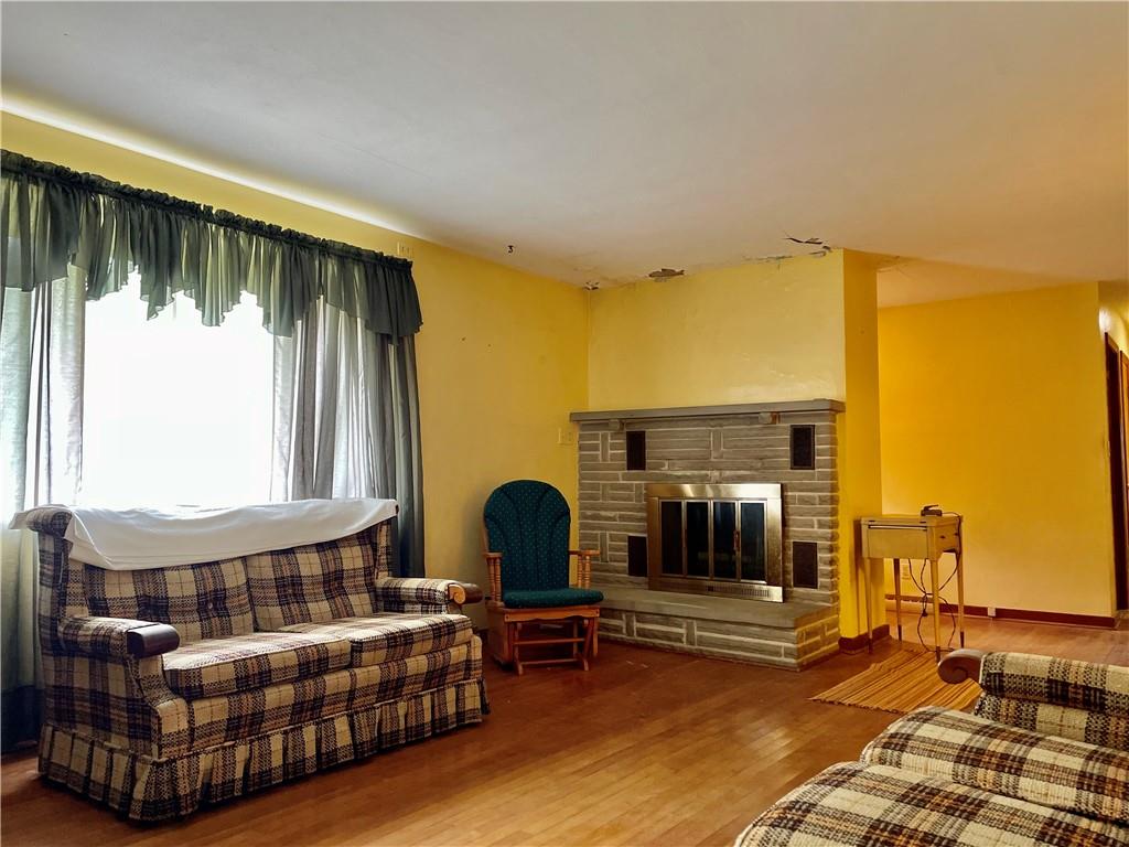 156 County Line Road Acme, PA 15610 - Photo 4 of 19 a living room with furniture and a fireplace