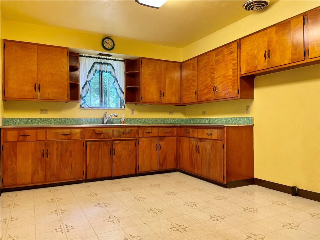 156 County Line Road Acme, PA 15610 - Photo 5 of 19 a bathroom with a sink and a mirror