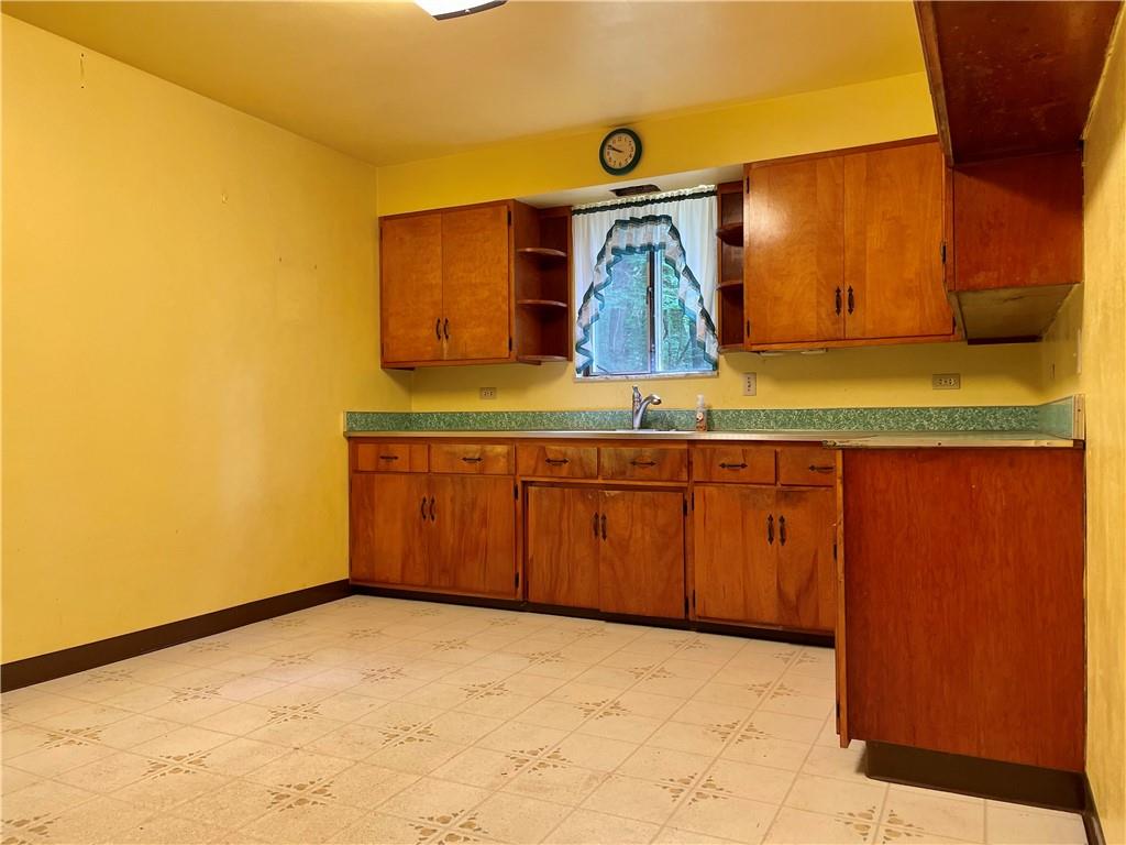 156 County Line Road Acme, PA 15610 - Photo 6 of 19 a bathroom with a sink and a mirror