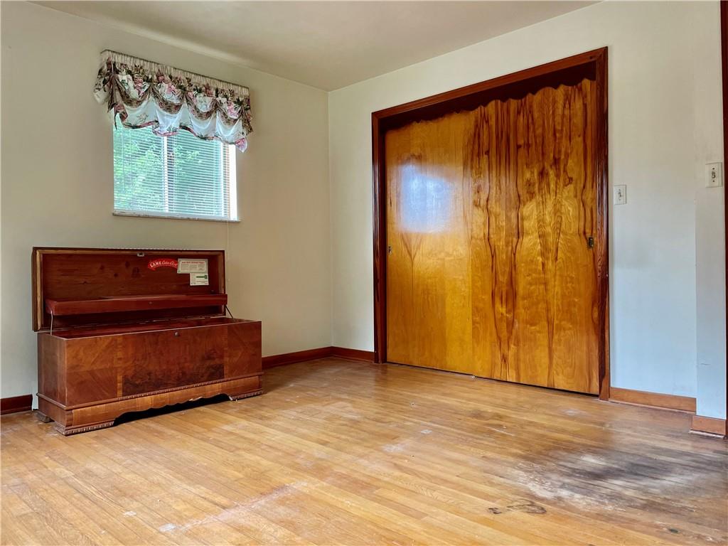 156 County Line Road Acme, PA 15610 - Photo 10 of 19 a view of a room with wooden floor and a window