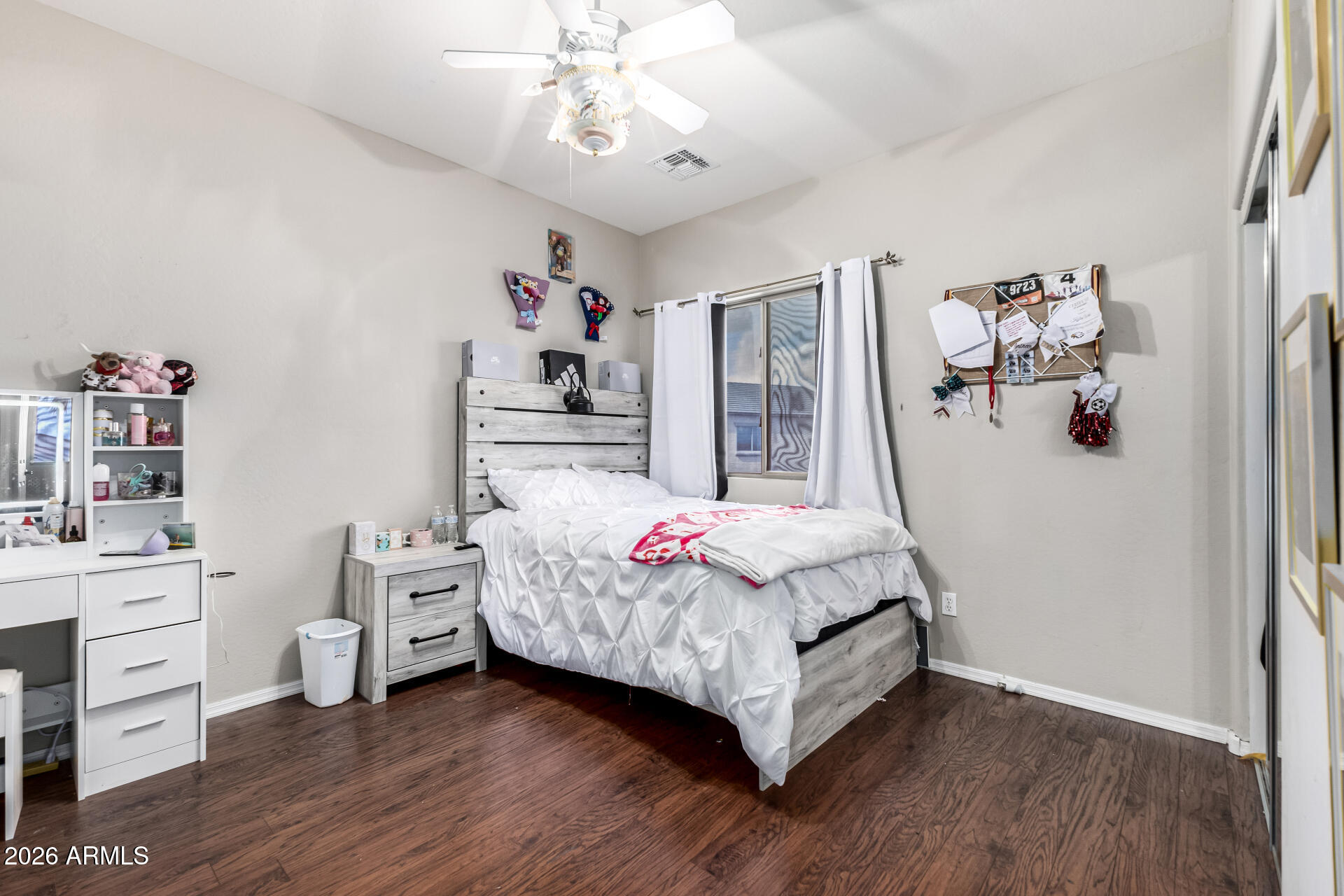24541 Plum Road Florence, AZ 85132 - Photo 26 of 47 a bedroom with a bed and a chandelier