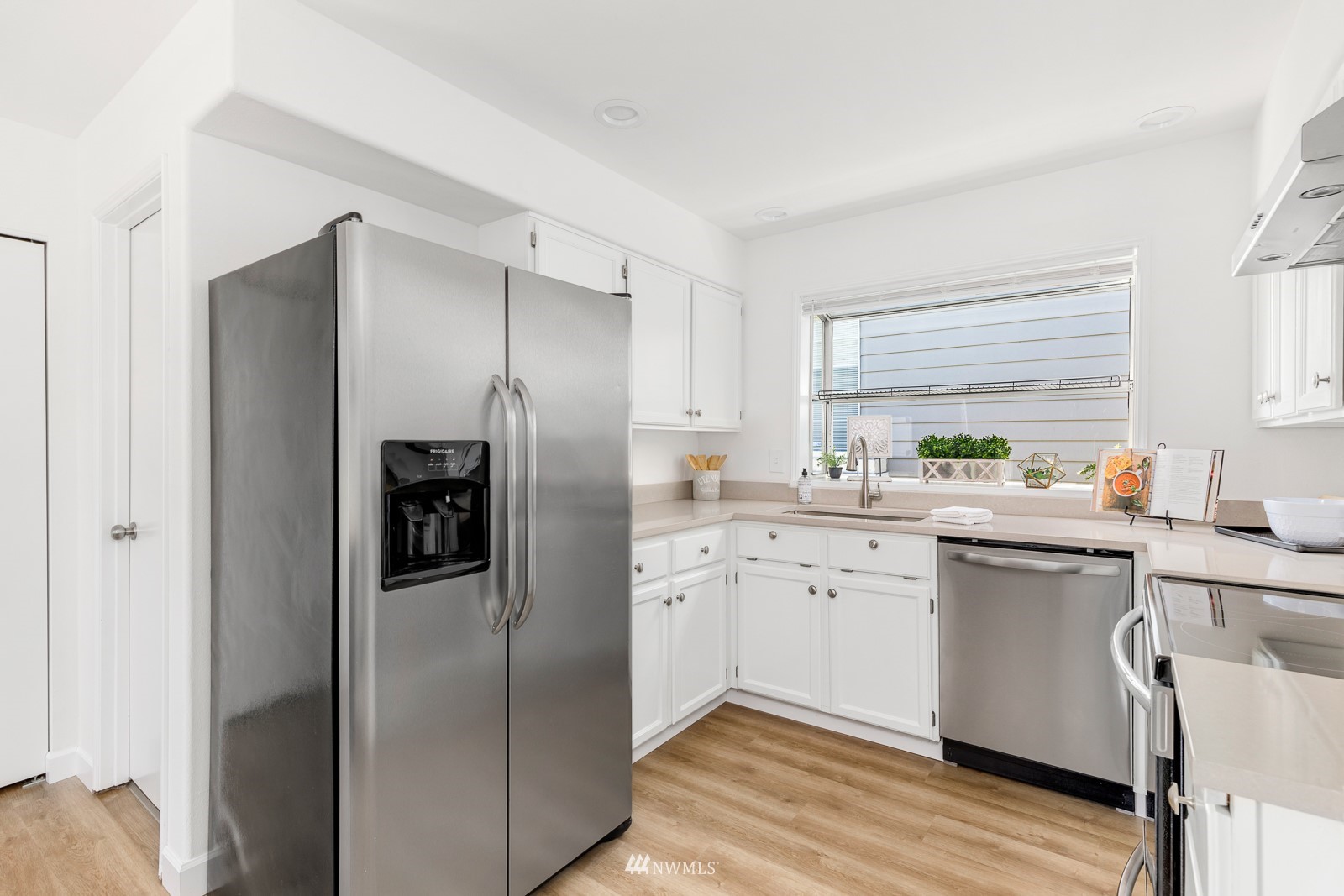 901 South 32nd Street Renton, WA 98055 - Photo 13 of 32 a kitchen with a refrigerator sink and cabinets