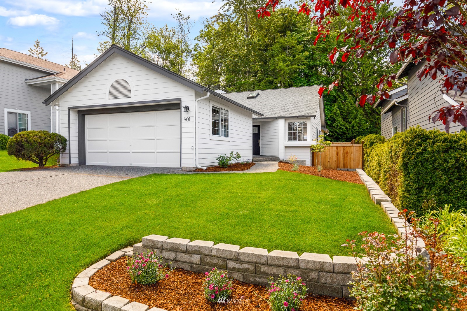 901 South 32nd Street Renton, WA 98055 - Photo 2 of 32 a front view of a house with a yard and garage