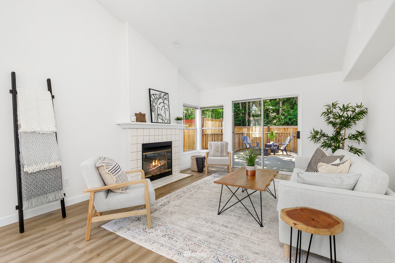 901 South 32nd Street Renton, WA 98055 - Photo 7 of 32 a living room with furniture a fireplace and a large window