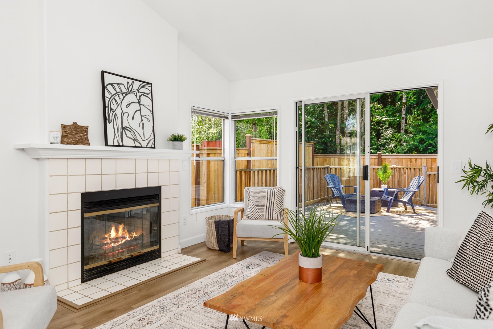 901 South 32nd Street Renton, WA 98055 - Photo 8 of 32 a living room with furniture a large window and a fireplace