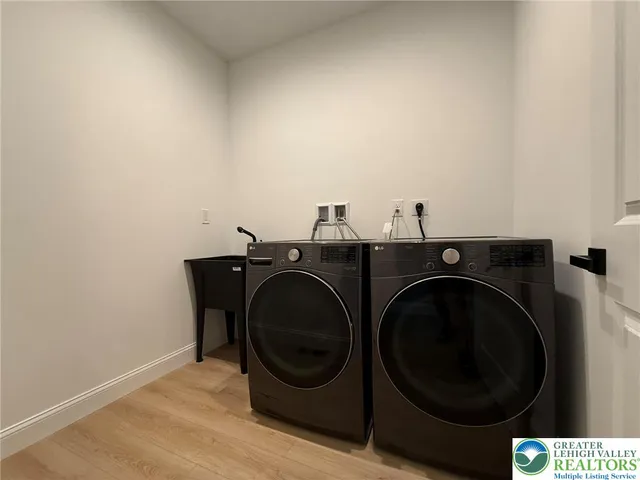 a bathroom with a granite countertop toilet a sink and a mirror
