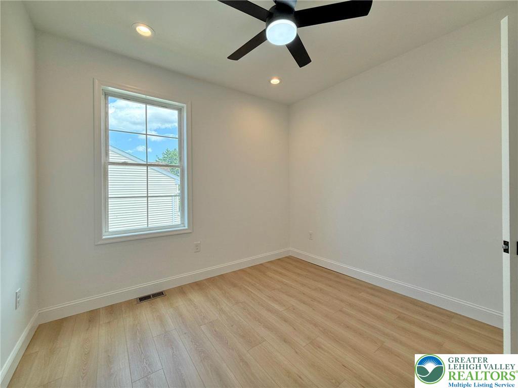 Strauss Lane, Unit 1 Bethlehem, PA 18015 - Photo 19 of 56 an empty room with a window and a fan