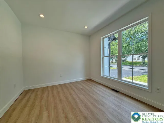 a house with swimming pool in front of it