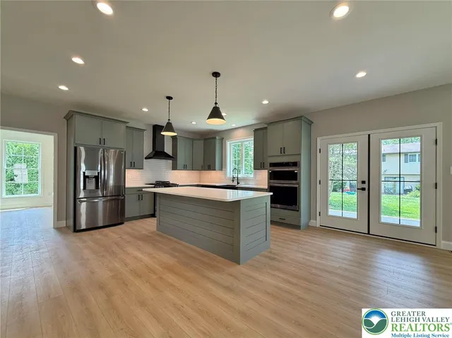 a view of livingroom with kitchen and fireplace