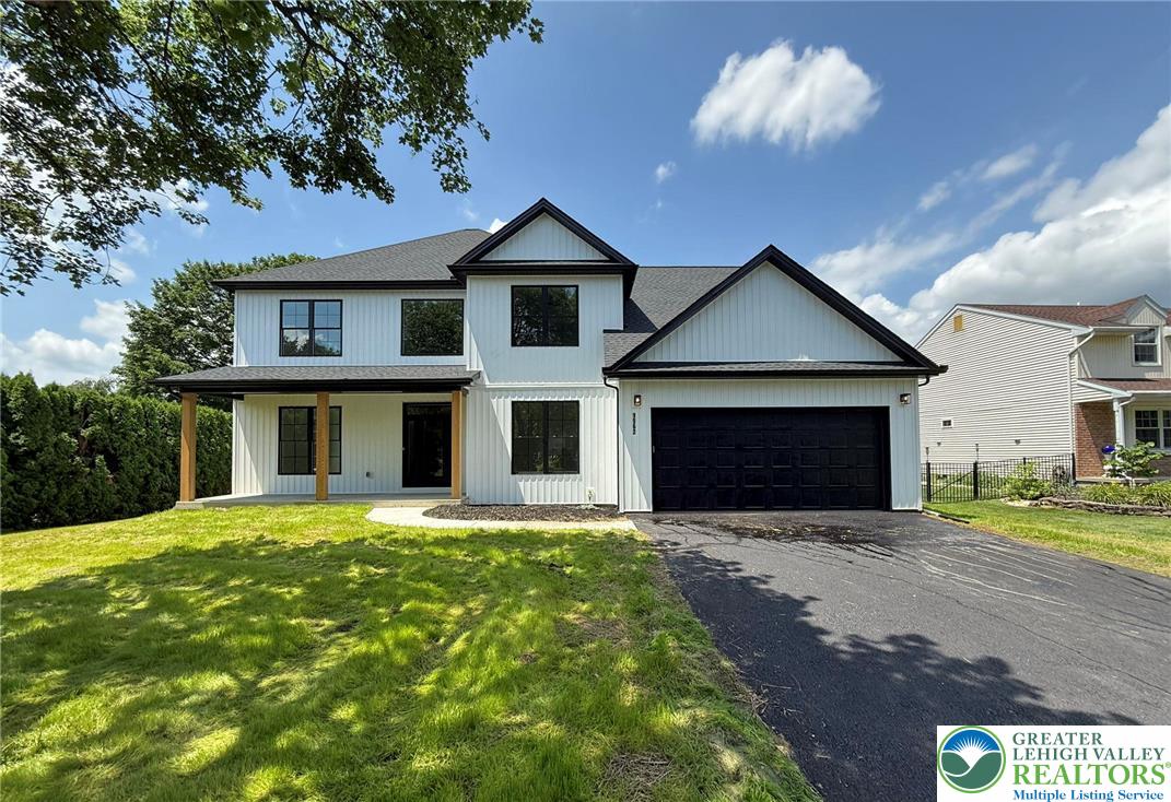 Strauss Lane, Unit 1 Bethlehem, PA 18015 - Photo 3 of 56 a front view of a house with a yard