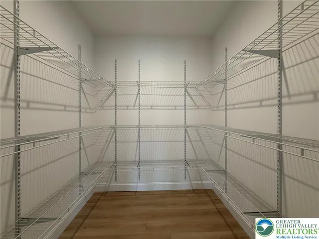 a view of hallway with wooden floor