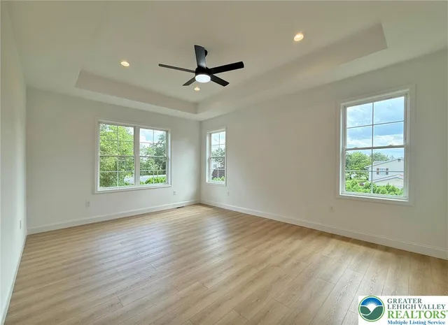 a white bath tub sitting next to a window
