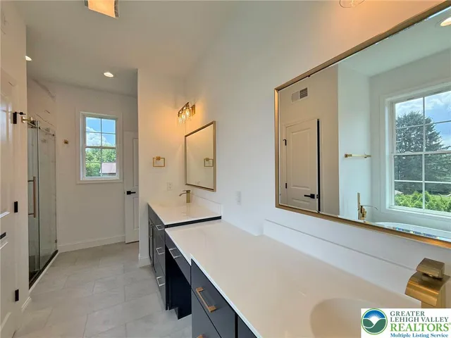 a white bath tub sitting in a bathroom