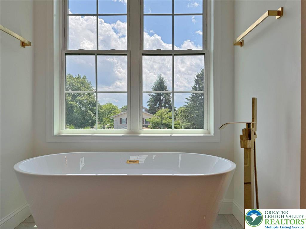 Strauss Lane, Unit 1 Bethlehem, PA 18015 - Photo 49 of 56 a white bath tub sitting next to a window