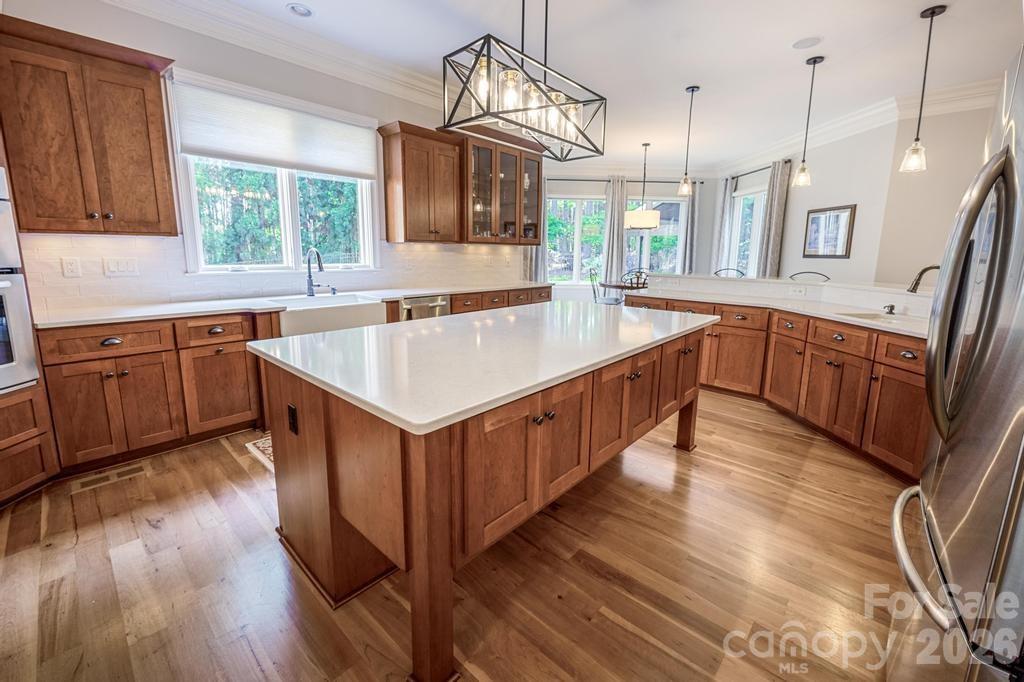 7315 Bay Ridge Drive Denver, NC 28037 - Photo 9 of 39 a kitchen with counter top space and wooden floor