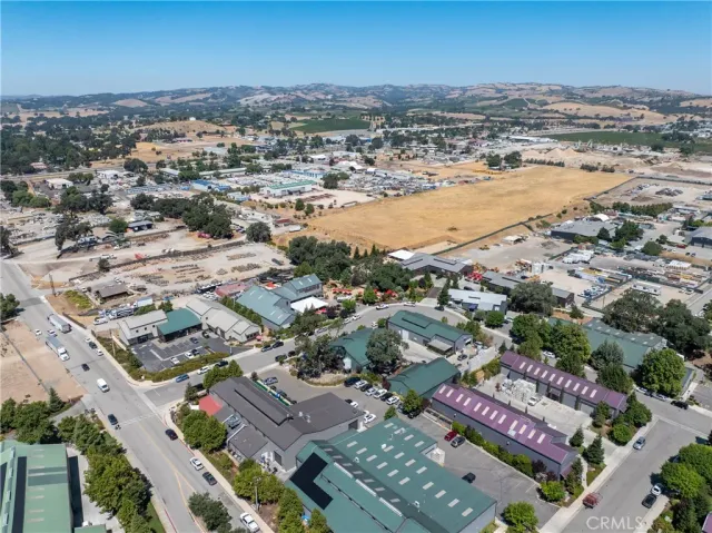 an aerial view of residential building and ocean