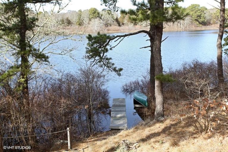 1020 Samoset Road Eastham, MA 02642 - Photo 15 of 16 a view of a tree in front of a yard