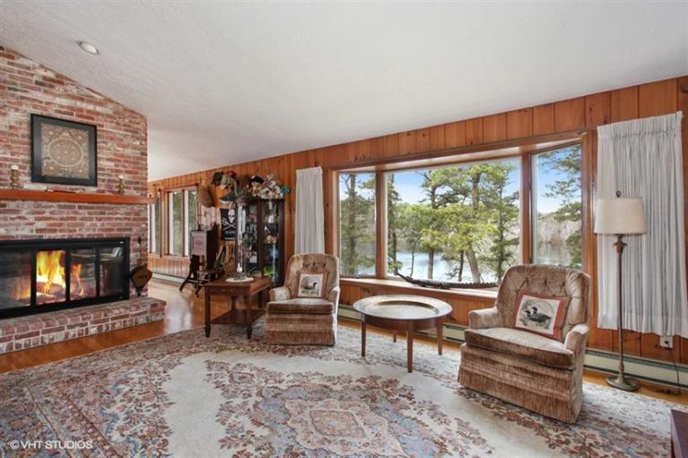 1020 Samoset Road Eastham, MA 02642 - Photo 3 of 16 a living room with furniture and a fireplace