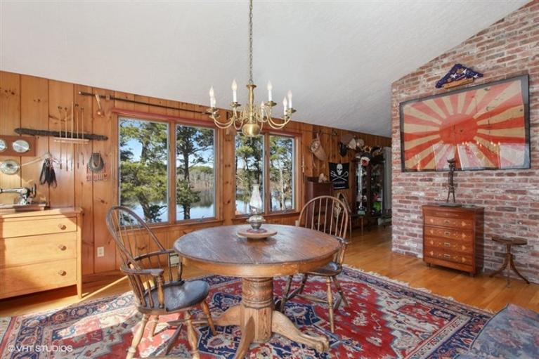 1020 Samoset Road Eastham, MA 02642 - Photo 4 of 16 a dining room with furniture a chandelier and wooden floor