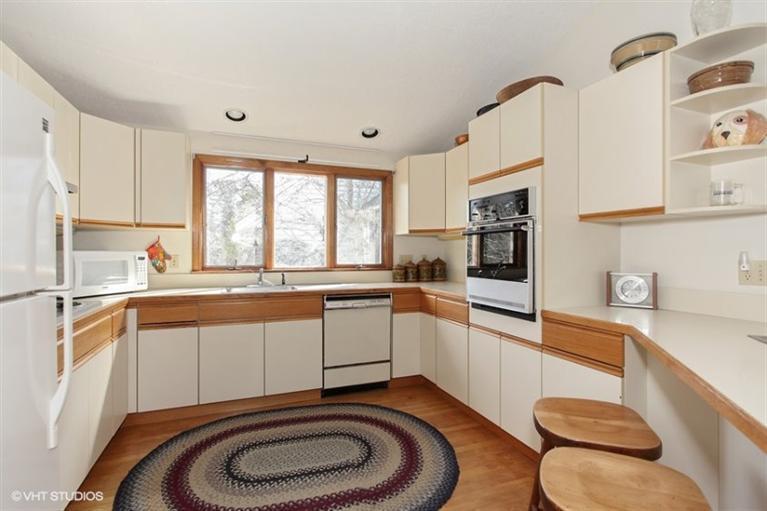 1020 Samoset Road Eastham, MA 02642 - Photo 5 of 16 a kitchen with a sink a stove a refrigerator cabinets and a window