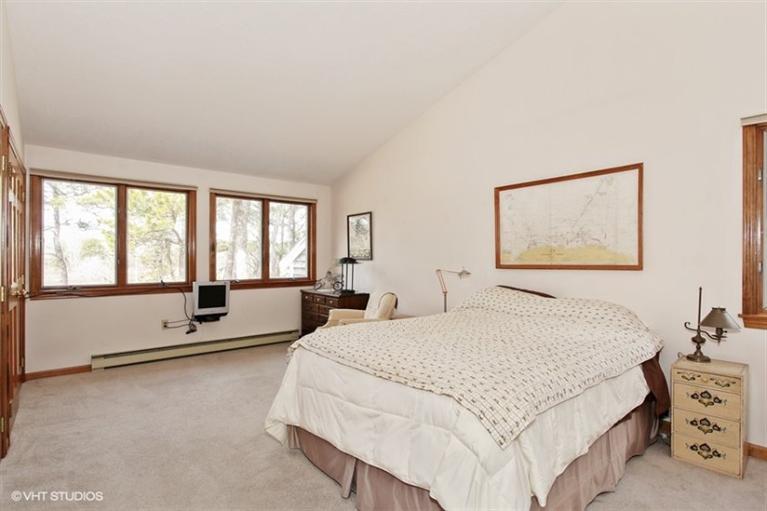 1020 Samoset Road Eastham, MA 02642 - Photo 8 of 16 a spacious bedroom with a bed and a large window