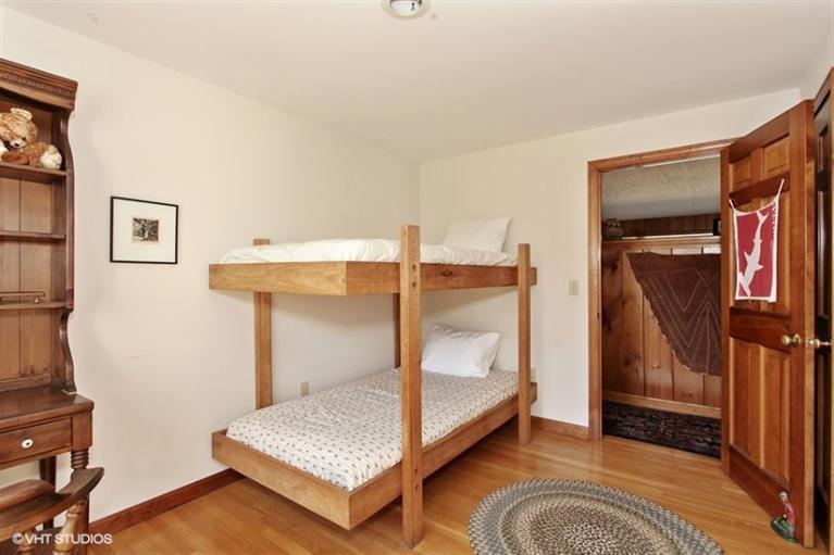 1020 Samoset Road Eastham, MA 02642 - Photo 9 of 16 a bedroom with a bed and a mirror