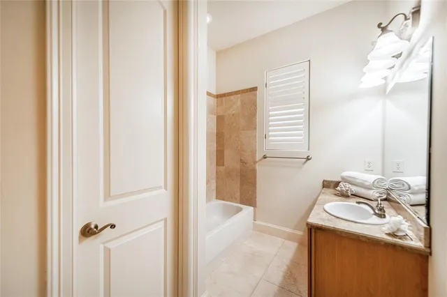 a garden with chairs in front of house