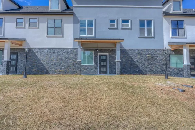 a front view of a house with an empty space