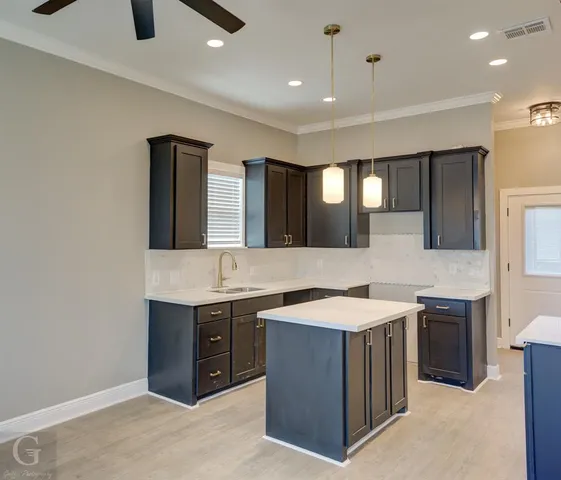 a bathroom with a sink a vanity and a mirror
