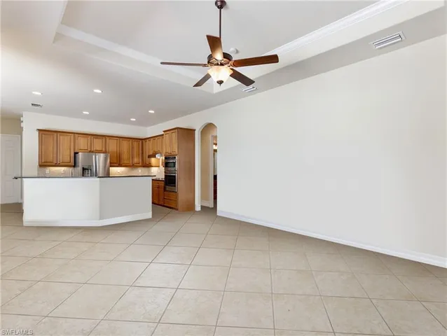 a view of a kitchen with a sink and cabinets