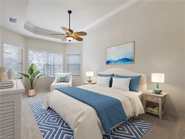 a bedroom with bed and a chandelier