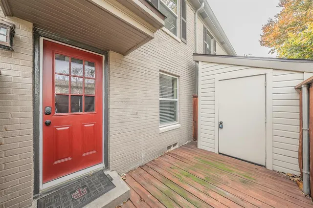 a view of a house with wooden floor and a window