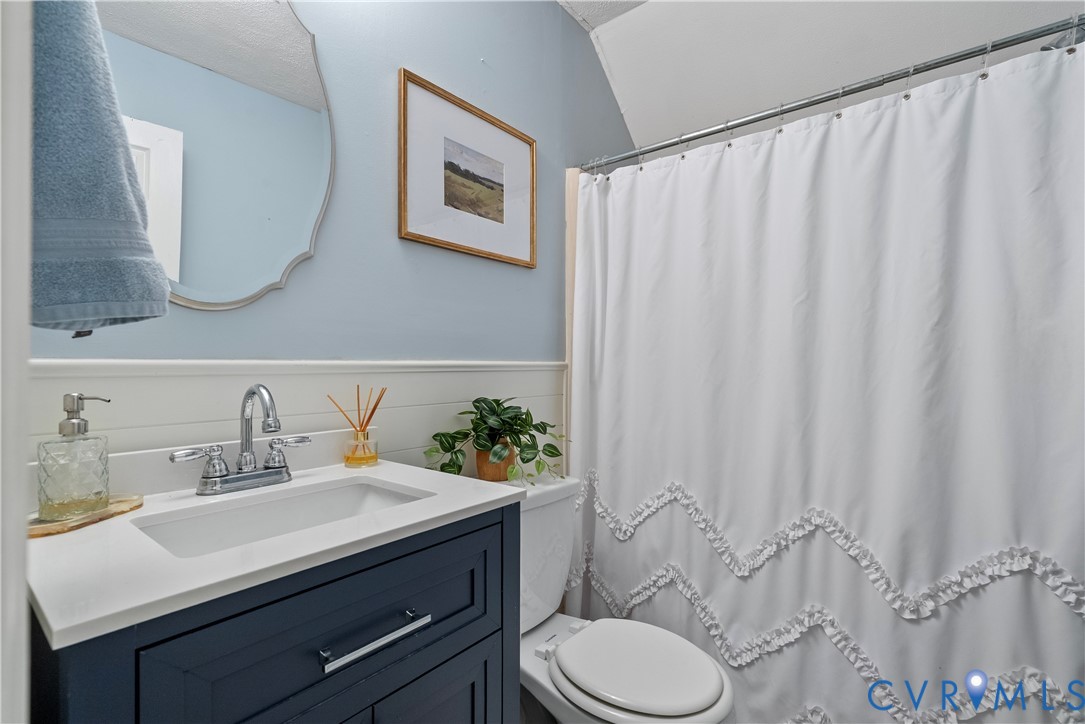 13207 Court Ridge Road Midlothian, VA 23112 - Photo 28 of 36 a bathroom with a sink vanity mirror and toilet