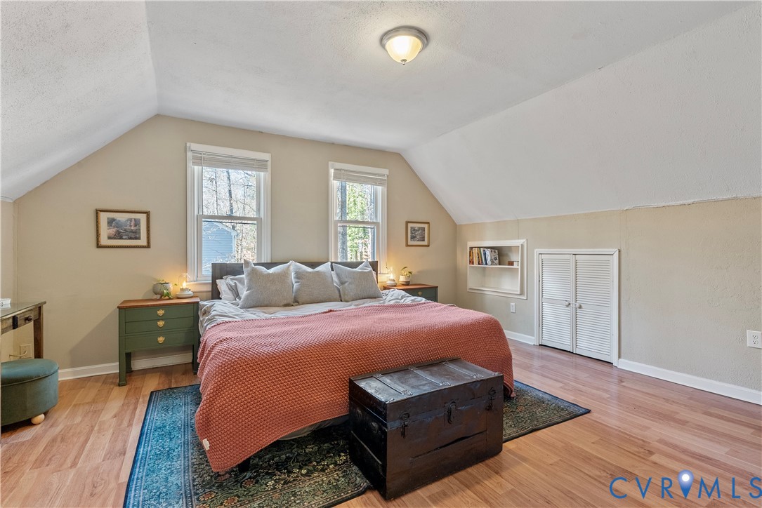 13207 Court Ridge Road Midlothian, VA 23112 - Photo 29 of 36 a bedroom with a bed and wooden floor