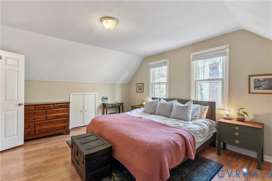13207 Court Ridge Road Midlothian, VA 23112 - Photo 30 of 36 a bedroom with a bed and wooden floor