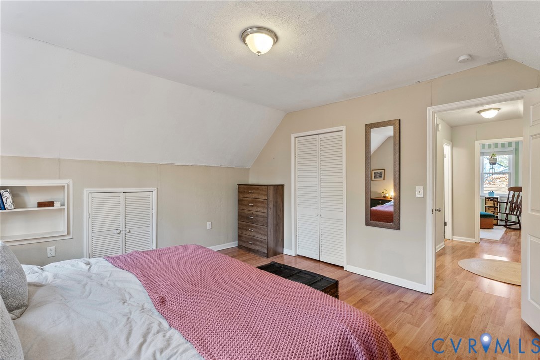13207 Court Ridge Road Midlothian, VA 23112 - Photo 31 of 36 a bedroom with a bed and a mirror