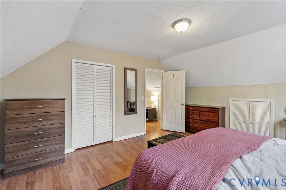 13207 Court Ridge Road Midlothian, VA 23112 - Photo 32 of 36 a bedroom with a bed and wooden floor